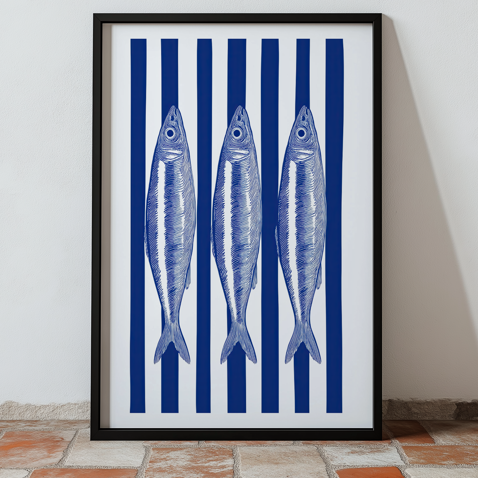 Framed wall art featuring three sardines on blue and white stripes.