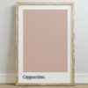 A framed print featuring a cappuccino-colored swatch above the word "Cappuccino." in a modern, sans-serif font, set against a white background.