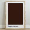 A framed print featuring a dark brown color swatch with the text "Doppio espresso." in bold, lowercase typography at the bottom, set against a light wall.