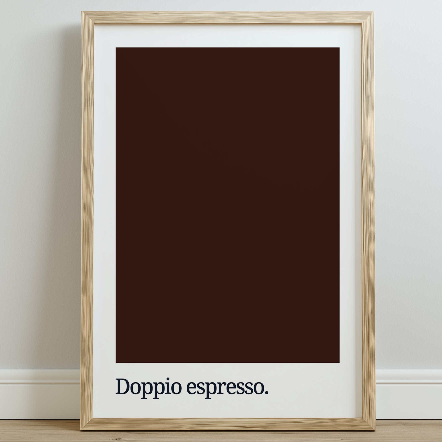 A framed print featuring a dark brown color swatch with the text "Doppio espresso." in bold, lowercase typography at the bottom, set against a light wall.