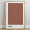 Framed poster featuring a solid mocha brown color swatch with the word "Mocha." printed in black lowercase letters at the bottom, set against a light wall.